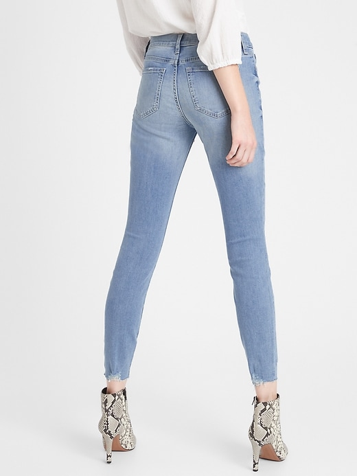 Petite Mid-Rise Light Wash Destructed Skinny Jean Banana