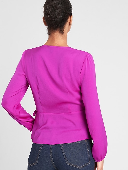 ruffle hem wrap blouse