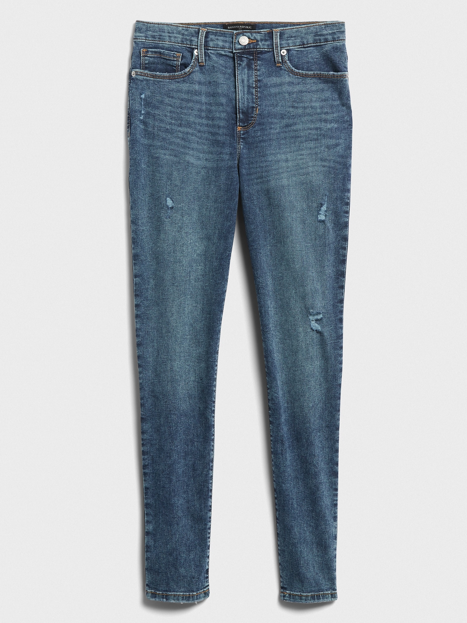 High-Rise Soft Touch Medium Wash Destructed Skinny Jean
