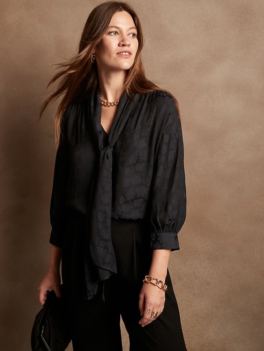 dark blue shirt and jeans